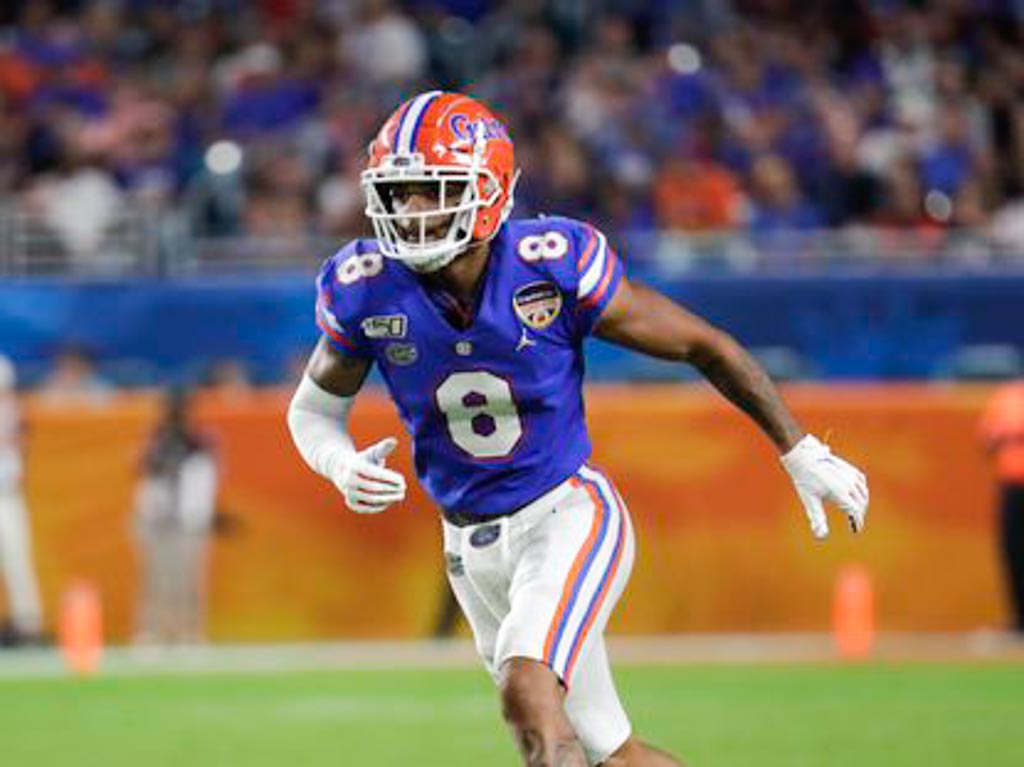 Florida linebacker Brenton Cox wearing a blue jersey adorning the number 8.