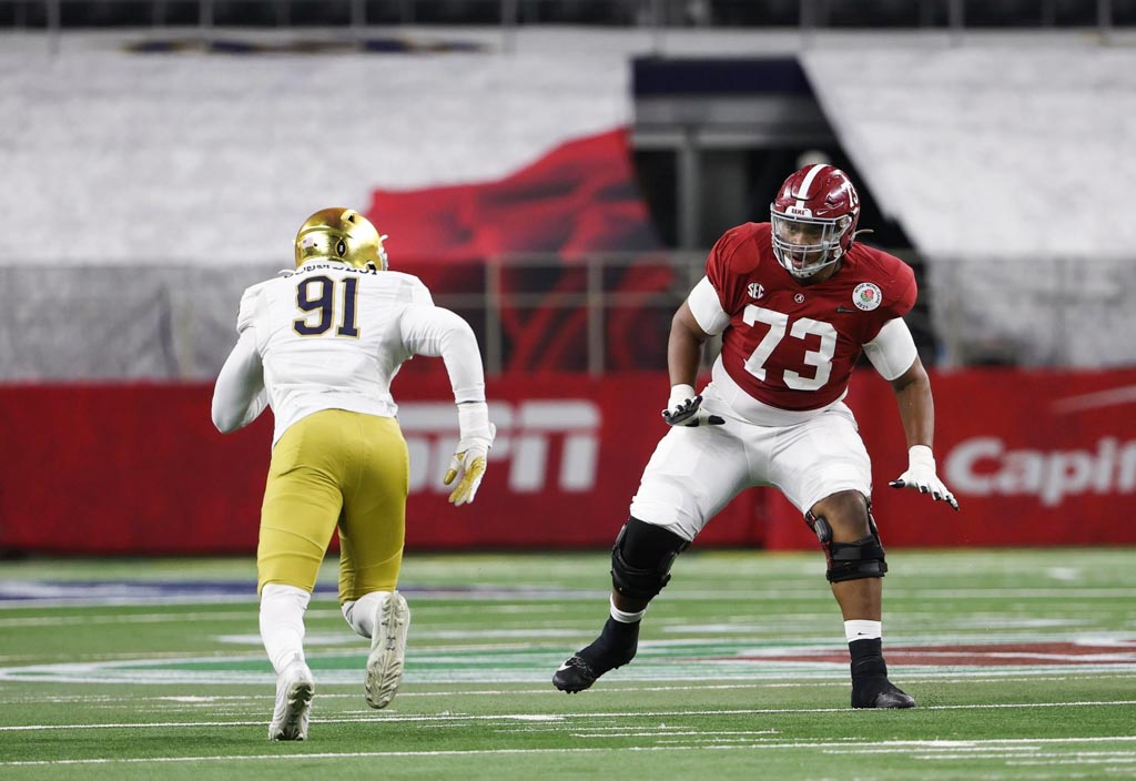 Alabama left tackle Evan Neal prepares to block a Notre Dame defender.