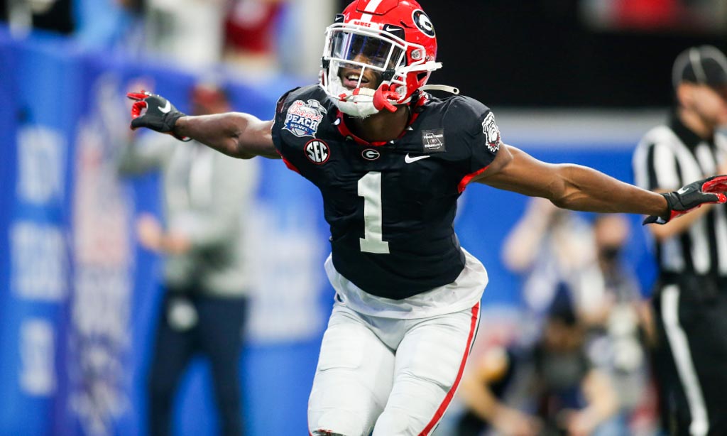 Georgia Bulldogs WR George Pickens celebrates with his arms extended like an airplane.