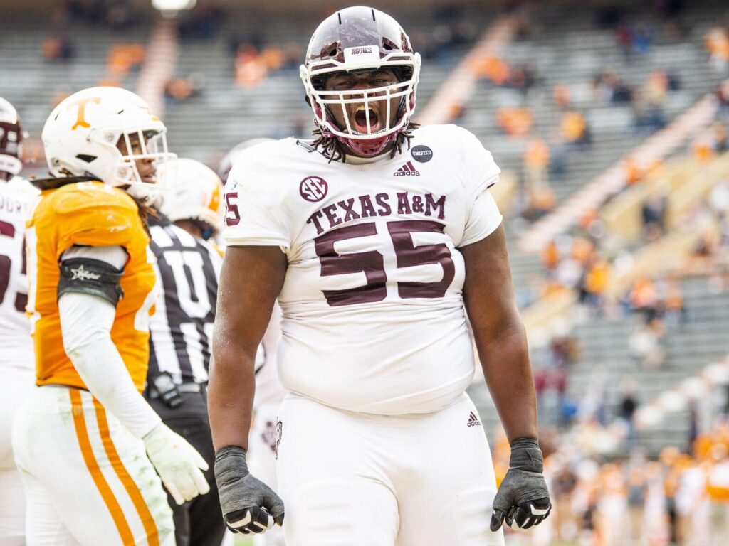 Aggies guard Kenyon Green wearing number 55 screams mid game.