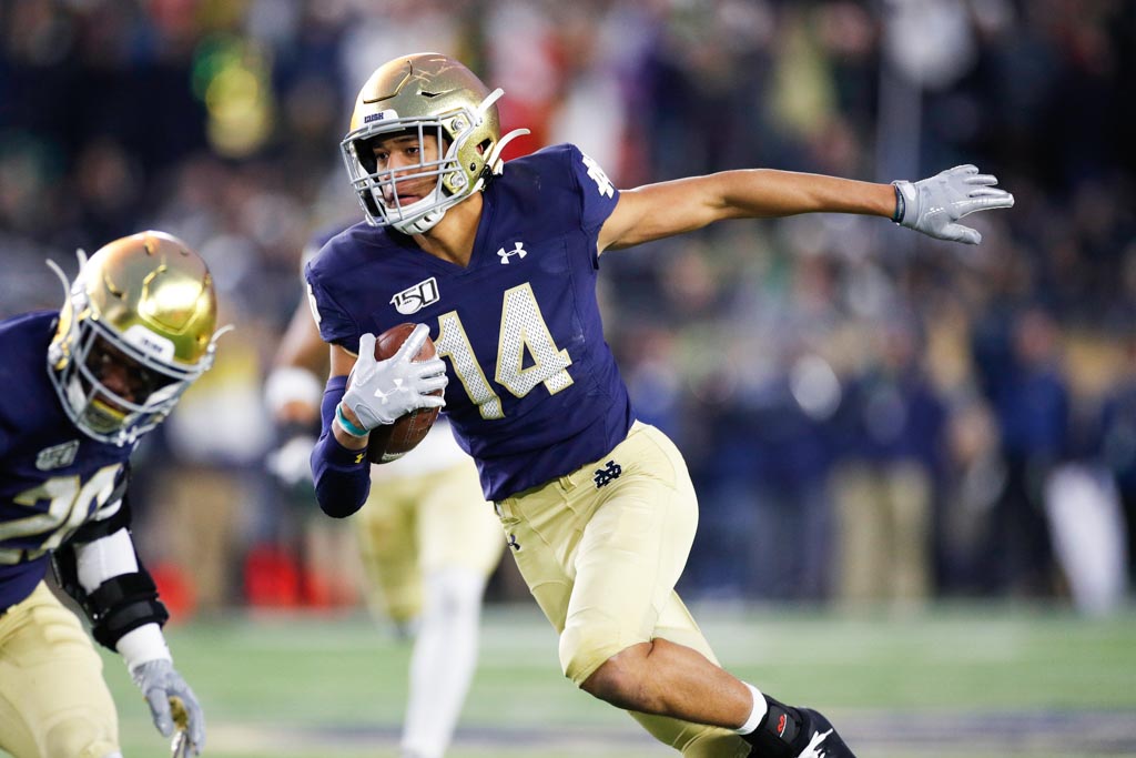 Notre Dame Safety Kyle Hamilton running with the football.