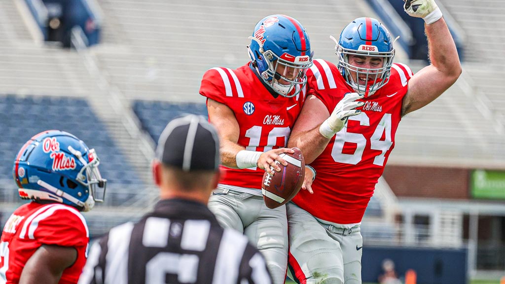 Ole Miss Tackle Nick Broeker celebrates with his Qb.