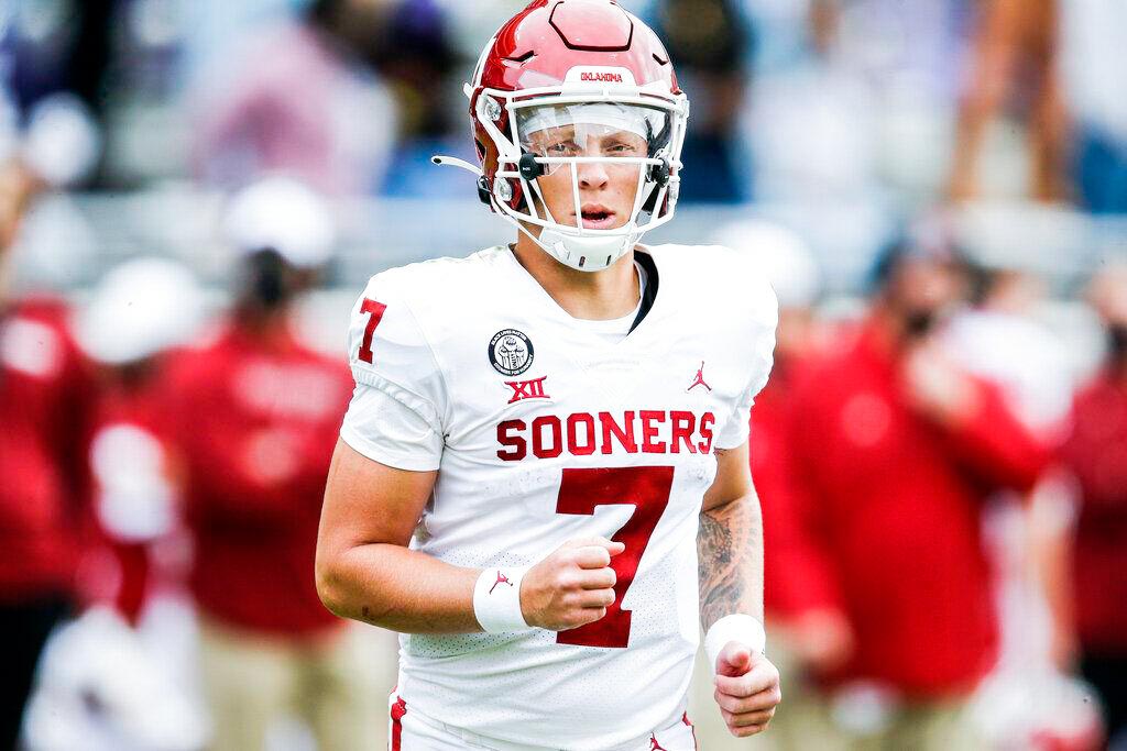 Oklahoma Sooners quarterback Spencer Rattler running onto field.