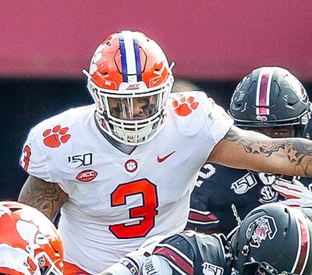 clemson defensive end Xavier Thomas wearing a white jersey with orange number 3.
